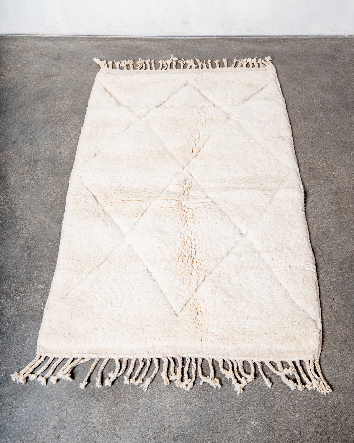 Modern, designer, handcrafted Berber rug from Morocco. Beniourain carpet with minimalist design, natural wool pile and a fluffy texture.